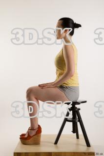 Sitting reference of whole body yellow t shirt gray shorts…